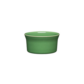 The Retired Fiesta 8 OZ Ramekin 4 Inch by Fiesta features a small, round design in Meadow green ceramic with slightly flared sides; this oven-safe piece is shown on a white background.