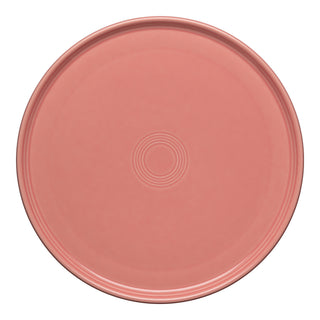 The Fiesta Retired 12 Inch Round Baking and Serving Platter in Peony features smooth, lead-free ceramic with a subtle concentric circle pattern, shown from above on a white background.