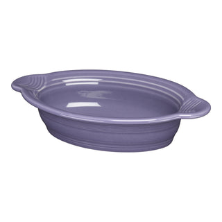 The Fiesta Lavender 9 1/8 Inch Oval Individual Casserole (13 oz) features side handles and a ceramic build, ideal for oven-to-table use. Shown empty on a white background, it's stylish and functional bakeware.