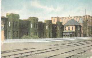A vintage postcard shows the ivy-covered, castle-like facade of the Homer Laughlin China Company building in Newell, West Virginia, with railway tracks in front and LAUGHLIN visible on the roof.