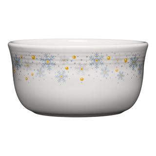 The Fiesta White Snowflake All-Purpose 6 Inch Gusto Bowl 28 OZ features blue snowflakes and yellow dots on white ceramic, festive dinnerware made in the USA.