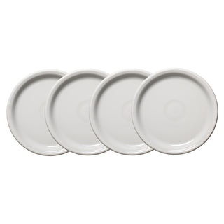 The Fiesta White Bistro Coupe 9 Inch Luncheon Plate Set of 4 features sleek, dishwasher-safe plates arranged diagonally on a white background, showcasing their modern design and convenience.