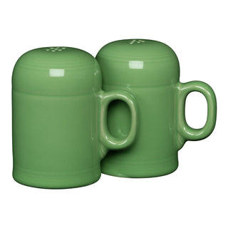 The retired Fiesta 4 5/8 inch Rangetop large salt and pepper shaker set by Fiesta features two green handled shakers, made in the USA, placed closely together on a white background.