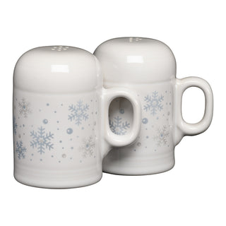 Two white ceramic mugs with blue snowflake patterns are stacked upside down, handle to handle. Reminiscent of the Fiesta White Snowflake 4 5/8 Inch Rangetop Large Salt and Pepper Shaker Set, these mugs feature rounded tops, a glossy finish, and are proudly made in the USA.
