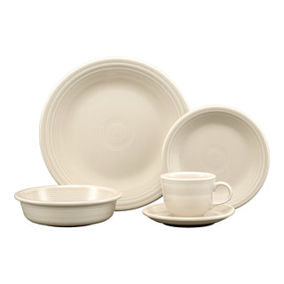 The Fiesta Retired Linen Classic Rim 5-Piece Place Setting, Service for 1, includes a dinner plate, salad plate, bowl, cup, and saucer in cream-colored lead-safe china with simple embossed circular patterns.