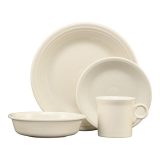 The Fiesta Classic Rim 4-Piece Place Setting in Linen includes a dinner plate, salad plate, bowl, and mug with vintage ring handle and subtle concentric circle patterns—perfect for one.