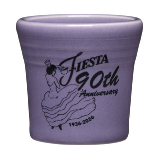 Celebrate Fiesta’s heritage with the Fiesta 90th Anniversary 1 1/2 OZ Ceramic Shot Glass—lavender glazed, features a black illustration and anniversary text. A perfect limited-edition collectible!.