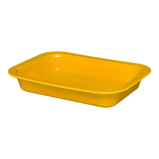 A rectangular, shallow daffodil-colored plastic tray with rounded corners and smooth edges, the Retired Fiesta Rectangular 9x13 Inch Baker 3 Quart by Fiesta is proudly made in the USA.