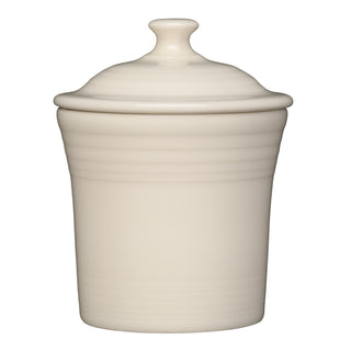 The Fiesta Retired Linen 13 OZ Mini Canister (5 5/8 inch) features a cream-colored ceramic build with a lid and round knob, subtle horizontal ridges near the top, and lead-safe china—perfect for kitchen storage and shown against a white background.