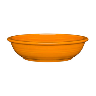 The Fiesta Retired Large Pasta Bowl in tangerine is a wide-rimmed, shallow dish made from lead-free china and shown on a white background.