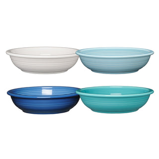 The Fiesta Mixed Coastal Blues Classic Rim 8 3/8-Inch 34OZ Pasta Bowls set includes four lead-free ceramic bowls in white, light blue, dark blue, and turquoise—perfect for safe and stylish dining.