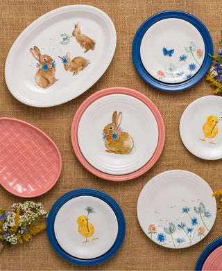 The Fiesta Retired Breezy Floral Easter 13 5/8" Large Oval Serving Platter features bunny & babies on vitrified china, arranged with floral accents. Dishwasher safe and proudly made in the USA.