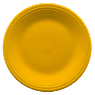 A round, bright yellow plate with subtle concentric ridges near the edge, shown from above against a white background.