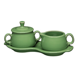 The Fiesta Retired 4-Piece Sugar Bowl and Creamer Set with Tray features a green ceramic sugar bowl with lid and matching creamer, all crafted from lead-safe china and presented on a coordinating oval tray.