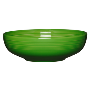 The Fiesta Retired Bistro Coupe 10 1/2 Inch Extra Large Bowl (96 oz) in Shamrock features a glossy green ceramic finish with subtle horizontal ridges, made in the USA and shown on a white background.