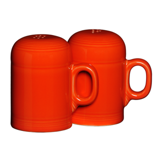 The Retired Fiesta 4 5/8 Inch Rangetop Large Salt and Pepper Shaker Set by Fiesta features two bright orange, vitrified china shakers with mug-style handles, displayed side by side against a white background.