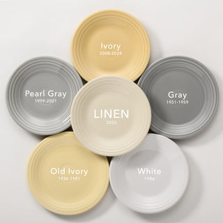 Six plates arranged in a circle, each labeled with a color and date: Pearl Gray (1999-2001), Ivory (2008-2024), Gray (1951-1959), White (1986), Old Ivory (1936-1951), and Linen (2025) in the center.