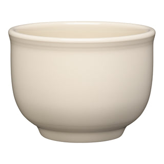 The Fiesta Retired Linen 4 5/8 Inch Jumbo Bowl (18 OZ) is a cream-colored ceramic bowl with a smooth, rounded shape and slightly flared rim. Made in the USA, it's microwave safe and shown against a white background.