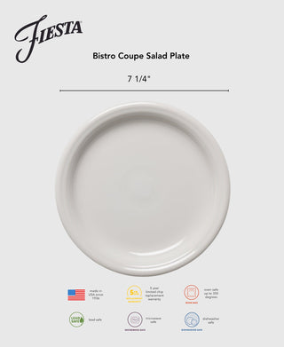 A Lavender Bistro Coupe 7 1/4 inch Salad Plate by Fiesta is centered on a light gray background, with icons below indicating it's lead safe, microwave and dishwasher safe, oven safe, and made in the USA.