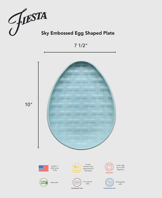 The Fiesta Retired Embossed Egg Shaped Plate is light blue with a woven basket texture, measuring 10" x 7.5". Fiesta logo, product info, warranty, safety, and origin icons surround the plate.