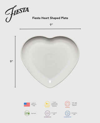 A Lavender Fiesta 9 Inch Heart Shaped Plate, shown on a light background with features below—dishwasher, microwave, and oven safe. Fiesta logo at left. An ideal collector’s item for any table setting.