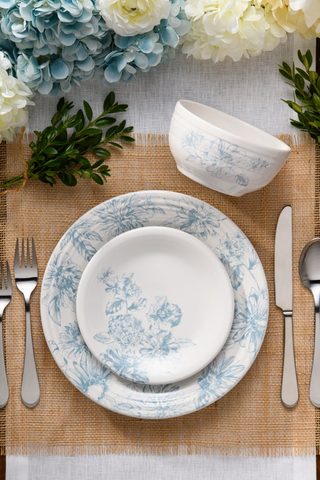 The Fiesta Botanical Floral Sky Classic Bistro 3-Piece Place Setting, Service for 1, showcases floral-patterned dinnerware with a bowl and plate, accented by silverware, greenery, and hydrangeas for a timeless bistro-style table.