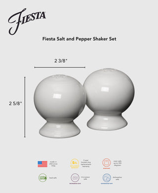 The Retired Fiesta 2 5/8 Inch Salt and Pepper Shaker Set features two round, white shakers with a glossy finish and wide base, measuring 2 3/8" wide by 2 5/8" high. Made in the USA by Fiesta. Lead safe and dishwasher safe.
