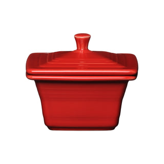 The Fiesta Retired Covered Box, 4 5/8" x 3 3/4" in scarlet, features a square ceramic design with a matching lid and small knob handle—ideal as a stylish storage container.