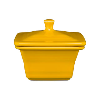 The Fiesta Retired Covered Box (4 5/8" x 3 3/4") in daffodil features a square ceramic design with a matching lid and knob handle, shown against a plain white background.