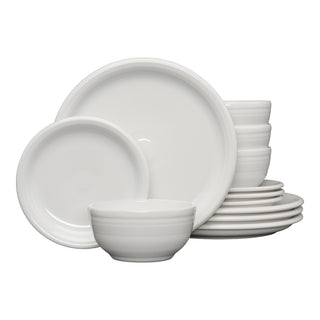 The Fiesta Bistro Coupe 12-Piece Dinnerware Set in white, designed for 4, features modern plates and bowls neatly stacked against a plain white background.