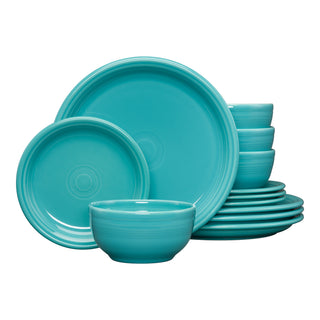 The Fiesta Bistro Coupe 12-Piece Dinnerware Set in turquoise, designed for service for 4, features glossy plates and bowls with simple concentric circles stacked together against a white background.