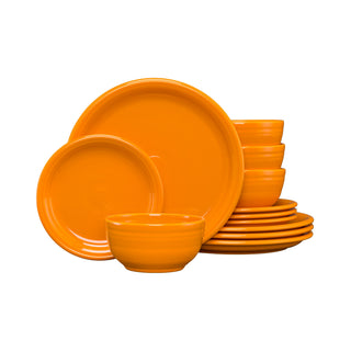 The Fiesta Retired Bistro Coupe 12-Piece Dinnerware Set, Service for 4, in butterscotch, features plates and a bistro bowl stacked neatly. This lead-safe china is made in the USA.