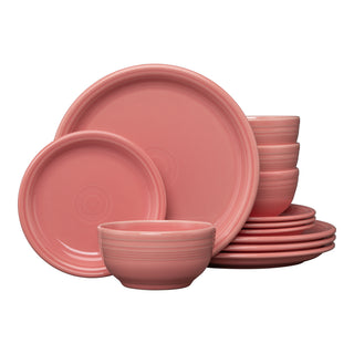 The Fiesta Bistro Coupe 12-Piece Dinnerware Set in peony, service for 4, features plates and bowls stylishly stacked against a white background.