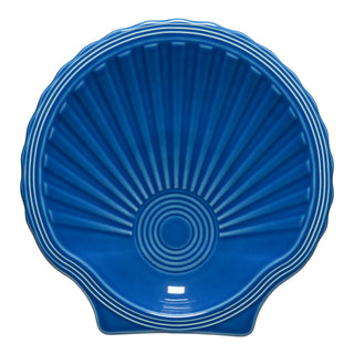 The Fiesta Retired Shell Shaped Plate 8 1/4 Inch in lapis features a glossy, ridged, fan-like design—an elegant ocean-inspired piece to enhance your Coastal Collection.