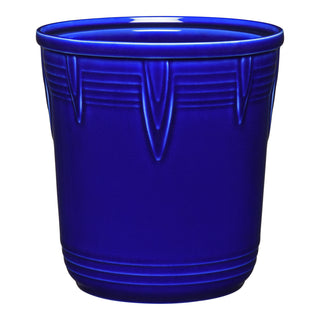 The Retired Fiesta 7 Inch Chevron Utensil Crock is a vibrant cobalt blue ceramic piece with embossed chevron patterns, ideal as a kitchen canister or utensil holder, shown against a white background.