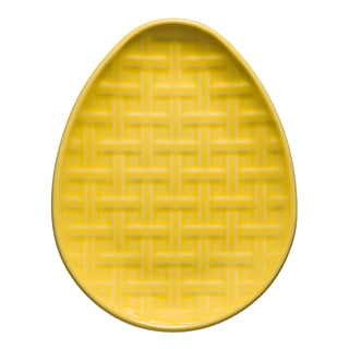The Fiesta Retired Embossed Egg Shaped Plate, 10 inches in sunflower, features a raised woven basket pattern and is shown on a white background.