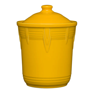 The Retired Fiesta 2 Quart Medium Chevron Canister in daffodil features vertical ridges and a fitted, airtight lid, making it perfect for colorful kitchen storage. Shown against a white background.