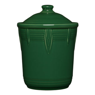 The Fiesta Retired 2 Quart Medium Chevron Canister in jade features a matching lid with a round knob, vertical ridges, a glossy finish, and decorative detailing near the top—ideal for colorful kitchen storage.