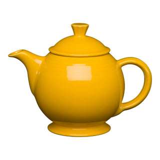The Retired Fiesta 44 OZ Covered Teapot by Fiesta in daffodil features a round body, curved spout, large handle, and fitted knob lid. This lead-safe china teapot is dishwasher safe and shown on a white background.