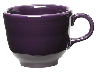 The Fiesta Retired Classic 7 3/4 OZ Tea Cup in plum features a glossy, deep purple glaze, round body, small base, and curved right-side handle. Shown on a white background, this lead-safe china is proudly made in the USA.