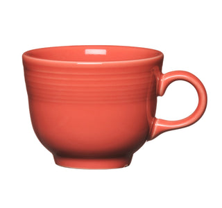 The Fiesta Retired Classic 7 3/4 OZ Tea Cup in Flamingo features a glossy finish, rounded body, and right-side handle. Crafted from lead-safe china in the USA, it's shown against a white background.