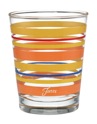 The Retired 15 oz. Fiesta® Sienna Sunset Stripes Tapered Double Old Fashion Set of 4 by Moderne Glass features clear USA-made glasses with horizontal orange, yellow, blue, and red stripes and "Fiesta" printed in white near the base.