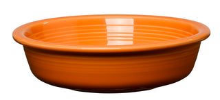 The Fiesta Retired Classic Rim 6 7/8 Inch Cereal Bowl (19 OZ) in tangerine is a round, shallow US-made ceramic bowl with ridged sides and glossy finish, crafted from fully vitrified china and shown on a plain white background.