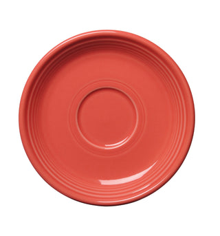 The Fiesta Retired Classic Rim 5 7/8 Inch Saucer in Flamingo is a round, coral-colored ceramic piece with subtle concentric ridges, shown from above on a white background. Dishwasher safe, it offers both style and practicality.