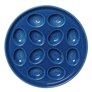 The Fiesta Retired Round Egg Serving Platter (11 1/4", Lapis) is a blue ceramic plate made in the USA, featuring twelve oval indentations with concentric ring designs, crafted from lead-safe china.
