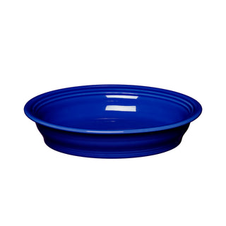 The Fiesta Retired Oval Baker, 10 1/4 in, 40 oz, in twilight features a glossy deep blue finish. Oven safe and stylish, it’s perfect for serving and entertaining. Shown on a white background.