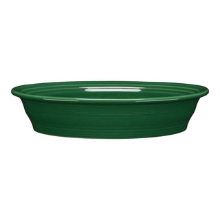 The Fiesta Retired Oval Baker, 10 1/4 in, 40 oz, features a smooth glossy jade ceramic finish with raised sides and is displayed against a white background.