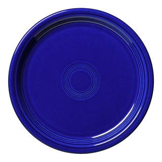A round Fiesta Bistro Coupe 9 Inch Luncheon Plate in twilight, made in the USA, with concentric rings near the center and rim, is viewed from above on a white background.