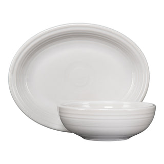 The white Fiesta 2-Piece Serve Set, featuring an 11 5/8" oval platter and a 38 oz Bistro bowl with subtle concentric circle patterns, is displayed against a plain white background.