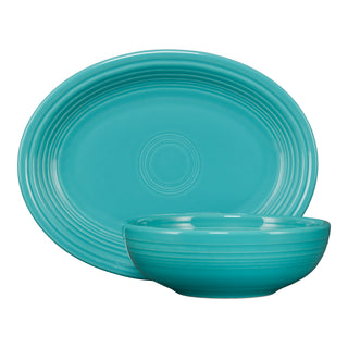 A turquoise Fiesta 2-Piece Serve Set featuring an 11 5/8 inch oval platter with concentric details and a matching 38 oz Bistro Bowl placed in front.